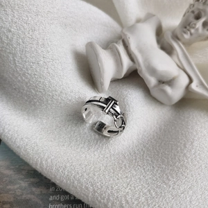 Detailed view of an S925 sterling silver belt-style ring with retro industrial texture
