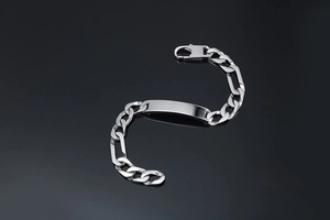 Detailed view of punk titanium steel ID chain bracelet with polished finish on black surface