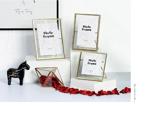 Golden geometric metal photo frames with minimalist glass flower house decor