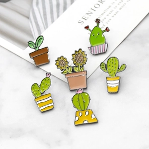 Set of six enamel pins featuring various green cactus and sunflower potted plant designs