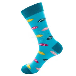 Detail of light blue crew socks featuring colorful knitted fish patterns and navy trim