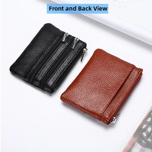 Close-up of black and brown pebbled leather coin purses with multi-zipper compartments