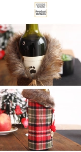 Detailed view of red and green plaid wine bottle cover with faux fur collar and wood button