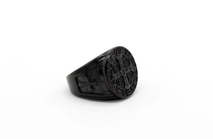 Close-up of black stainless steel St. Benedict medal ring with detailed cross relief