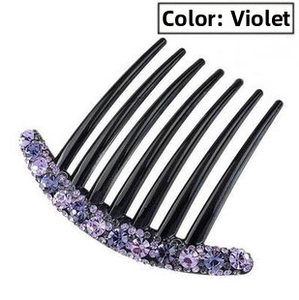 Detail view of seven-tooth hair comb with sparkling violet rhinestones on black base