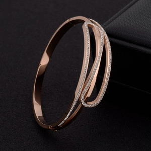 Rose gold stainless steel bracelet with crystal pavé and overlapping geometric curves