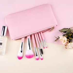 Pink 7-piece makeup brush set with gradient bristles and leather storage case