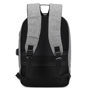 Gray anti-theft laptop backpack with USB port and padded mesh back on white background