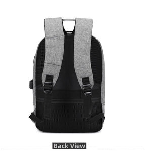 Detail of ergonomic padded straps, luggage belt and external USB port on grey backpack