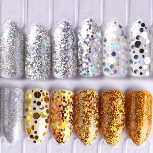 Close-up of 12 glitter nail art sample tips with holographic laser sequins on display