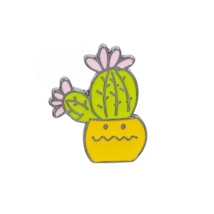 Detailed view of enamel cactus brooch with green plant and yellow flowerpot base