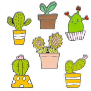 Set of six enamel pins featuring cute cartoon cactus and sunflower plant designs