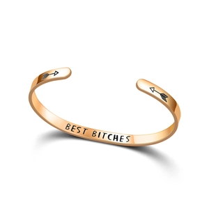 Close-up of rose gold stainless steel cuff bracelet with 'Best Bitches' engraving for friends