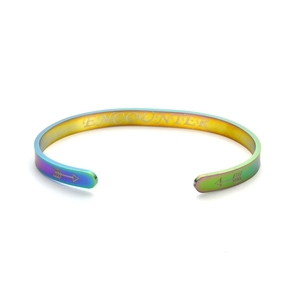 Macro view of iridescent stainless steel cuff bracelet with 'ENCOUNTER' engraving