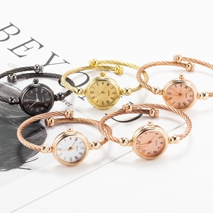 Group of elegant bangle watches with twisted steel cable straps in diverse metal finishes