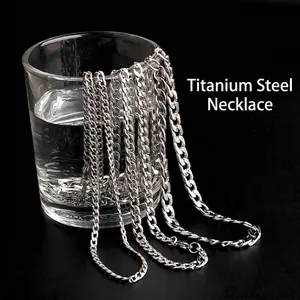 Waterproof silver titanium steel cuban chain necklace displayed on a glass with water