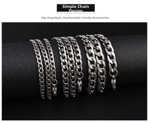 Close-up of three different widths of silver Cuban link chains with lobster clasps