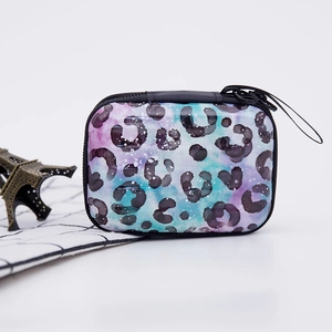 Detail of square leopard print tinplate coin purse with zipper and lanyard decoration