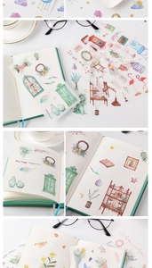 Close-up of vintage floral washi stickers applied on a journal with watercolor details