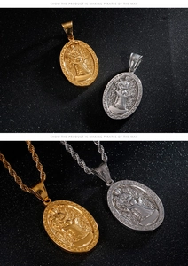 Macro detail of oval Virgin Mary pendant with Greek key border and twisted chain