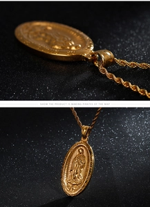 Detail of golden Our Lady of Guadalupe medallion with relief and textured twist chain