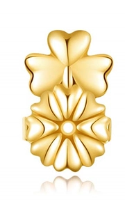 Detailed close-up of golden clover earring lifters with polished metallic finish