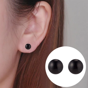 Minimalist black ball stud earrings for women shown on model and in detail view