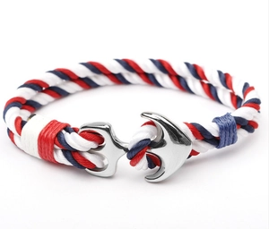 Detailed close-up of red, white and blue nautical anchor rope bracelet with metal clasp
