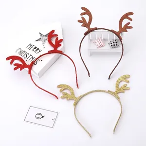 Three sequined reindeer antler headbands in red, gold, and brown for Christmas parties