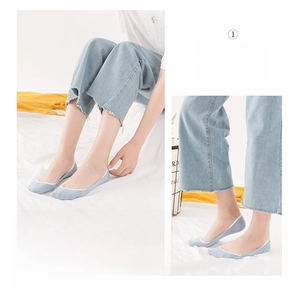 Close-up of light blue low cut invisible cotton socks with non-slip silicone heel grip
