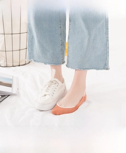 Detail of coral cotton no show sock on foot showing ultra-low cut seamless design