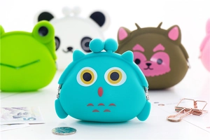 Close-up of cute cartoon silicone animal coin purses with metal clasp closure detail