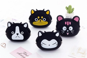 Detail of cute animal silicone coin purses with metal clasps and diverse cartoon designs