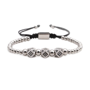 Detail of silver beaded bracelet with black zircon square charms and woven cord