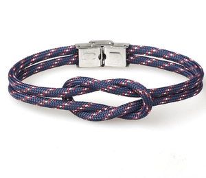 Detail of nautical paracord rope bracelet with stainless steel buckle and sailor knot