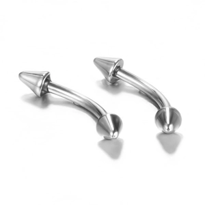 Close-up of polished stainless steel curved barbells for eyebrow and lip piercings