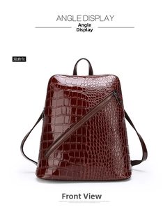 Front view of a burgundy crocodile pattern mini backpack with glossy finish and diagonal zipper