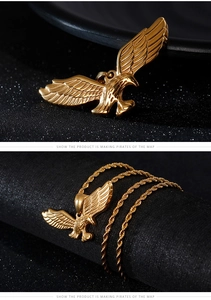 Detailed close-up of eagle wings pendant with golden rope chain and metal texture