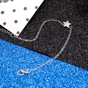Detail of silver star pendant bracelet with adjustable chain and lobster clasp closure