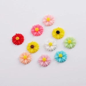 Macro shot of 12mm colorful resin daisy flower charms for DIY hair accessories
