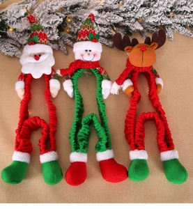 Detailed view of plush Santa, Snowman, and Reindeer Christmas ornaments on fabric
