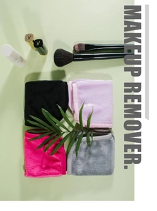 Flat lay of colorful microfiber makeup remover towels with beauty accessories