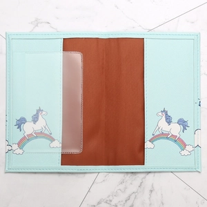 Light blue faux leather passport holder featuring rainbow unicorn and marble background
