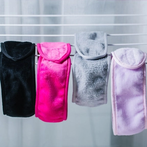 Hanging bamboo fiber facial headbands in black, rose red, grey, and lilac colors