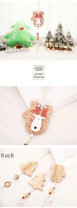 Detail of wooden reindeer ornaments with red snowflake patterns and natural twine loops