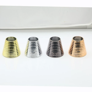 Detailed view of metal ponytail cuffs in gold, silver, black, and rose gold with ribbing