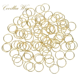 Close-up of golden hollow embossed rings for DIY hair accessories and dreadlock styling