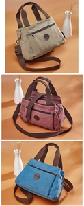 Detailed view of canvas tote bags in green, red, and blue with multi-pocket design