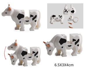 Detail view of cow building blocks with movable head and 6.5x3x4cm dimensions