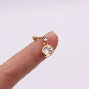 Detailed macro view of golden stainless steel flower zircon helix piercing earring